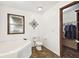 Bathroom featuring a toilet, tile floors, and walk-in closet at 18906 Merrich Rd, Orlando, FL 32820