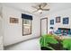 Bedroom featuring a ceiling fan, window, and furniture at 18906 Merrich Rd, Orlando, FL 32820