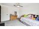 Relaxing bedroom with a plush bed, ample natural light, and a classic wooden dresser at 18906 Merrich Rd, Orlando, FL 32820