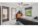 Bedroom featuring a ceiling fan, window, and furniture at 18906 Merrich Rd, Orlando, FL 32820
