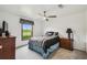 Bedroom featuring a ceiling fan, window, and furniture at 18906 Merrich Rd, Orlando, FL 32820