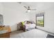 Inviting bedroom with a daybed, soft lighting, and a serene view from the window at 18906 Merrich Rd, Orlando, FL 32820