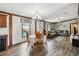 Inviting dining area with pool view, seamlessly connecting to the living room for easy socializing at 18906 Merrich Rd, Orlando, FL 32820