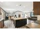 Open-concept kitchen with island, seamlessly blending into the dining and living areas, perfect for entertaining at 18906 Merrich Rd, Orlando, FL 32820