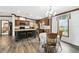 Bright kitchen with island, dining area, and ample natural light, creating a welcoming atmosphere at 18906 Merrich Rd, Orlando, FL 32820