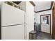 Bright laundry area featuring modern machines and a convenient access door at 18906 Merrich Rd, Orlando, FL 32820