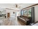 Cozy living room with wood floors, plenty of light, and an adjacent sitting room at 18906 Merrich Rd, Orlando, FL 32820