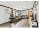 Comfortable living room featuring wood-look floors, creating a warm and inviting atmosphere at 18906 Merrich Rd, Orlando, FL 32820