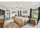 Light-filled main bedroom with a view to the living areas, providing an open and airy ambiance at 18906 Merrich Rd, Orlando, FL 32820