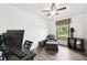 Functional home office space with modern desk setup and comfortable armchair seating at 18906 Merrich Rd, Orlando, FL 32820