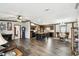 Bright open concept features wood trim, plank flooring, and a center island at 18906 Merrich Rd, Orlando, FL 32820