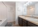 Bathroom with double sink vanity, shower and bathtub at 2294 Canyon Breeze Ave Ave, Kissimmee, FL 34746