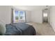 Cozy bedroom featuring natural light, carpeted floor, and ensuite bathroom at 2294 Canyon Breeze Ave Ave, Kissimmee, FL 34746