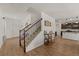Interior hallway with a staircase leading upstairs and an open view of the kitchen at 2294 Canyon Breeze Ave Ave, Kissimmee, FL 34746