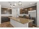 Modern kitchen featuring a spacious island, pantry and stainless steel appliances at 2294 Canyon Breeze Ave Ave, Kissimmee, FL 34746