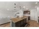 Kitchen with an island with granite countertops, stainless steel dishwasher and pendant lighting at 2294 Canyon Breeze Ave Ave, Kissimmee, FL 34746