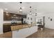 Modern kitchen boasting stainless steel appliances, granite countertops, and pendant lighting at 2294 Canyon Breeze Ave Ave, Kissimmee, FL 34746