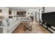 Comfortable living room featuring a large sectional sofa and an open layout to the kitchen at 2294 Canyon Breeze Ave Ave, Kissimmee, FL 34746