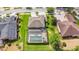 Aerial shot showcasing the home, fenced yard, landscaping, and screened pool at 2365 Sterling Creek Pkwy, Oviedo, FL 32766