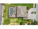 Aerial view of a home showcasing a screened-in pool and lush backyard at 2365 Sterling Creek Pkwy, Oviedo, FL 32766