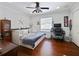 This bedroom features wood floors, a ceiling fan and a day bed with storage at 2365 Sterling Creek Pkwy, Oviedo, FL 32766