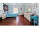 Bright, cheerful bedroom with hardwood floors and light blue walls and furniture at 2365 Sterling Creek Pkwy, Oviedo, FL 32766