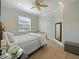 Comfortable bedroom featuring tile flooring, a ceiling fan, and natural light from the window at 2365 Sterling Creek Pkwy, Oviedo, FL 32766