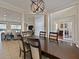 Charming dining room with elegant lighting open to living spaces at 2365 Sterling Creek Pkwy, Oviedo, FL 32766