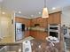 Well-equipped kitchen with stainless steel appliances, ample cabinet space and granite countertops at 2365 Sterling Creek Pkwy, Oviedo, FL 32766
