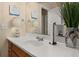 Bathroom featuring a large mirror, sink, and decorative accents at 241 Lake Thomas Dr, Winter Haven, FL 33880