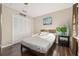 Comfortable bedroom with a full bed, hardwood floors, and double door closet at 241 Lake Thomas Dr, Winter Haven, FL 33880