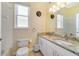 Bright bathroom with double sinks, granite countertops, and tiled tub-shower at 2787 Cypress Head Trl, Oviedo, FL 32765