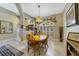 Comfortable dining room featuring natural light and a wood table with seating for four at 2787 Cypress Head Trl, Oviedo, FL 32765