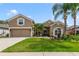 Charming home with well-maintained lawn, mature landscaping, and a two-car garage in a peaceful neighborhood at 2787 Cypress Head Trl, Oviedo, FL 32765