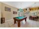 Spacious game room with a billiard table, natural light, and tile flooring at 2787 Cypress Head Trl, Oviedo, FL 32765