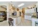 Bright kitchen featuring granite countertops, pendant lighting, and staircase access at 2787 Cypress Head Trl, Oviedo, FL 32765