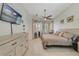 Bright main bedroom featuring tile flooring, ceiling fan, and a view to the backyard at 2787 Cypress Head Trl, Oviedo, FL 32765