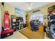 Well-lit office with large window, built-in shelving, and decorative accents at 2787 Cypress Head Trl, Oviedo, FL 32765