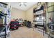 Spacious storage room featuring ample shelving, and a ceiling fan at 2787 Cypress Head Trl, Oviedo, FL 32765