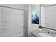 Bathroom with a combined bathtub and shower, a granite countertop vanity, and a decorative painting at 2919 Moulin Rd, Davenport, FL 33837