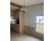 Dining room showcasing laminate countertops, backsplash, cabinets, tile flooring, and a window at 3009 Manatee Rd, Tavares, FL 32778
