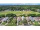 Aerial view of a neighborhood with a golf course and lush green landscape at 3018 Andover Ct, Mount Dora, FL 32757