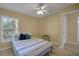 Bedroom featuring light hardwood floors, ceiling fan, and natural light at 3018 Andover Ct, Mount Dora, FL 32757