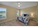 Bright bedroom with shutters, a ceiling fan, and a comfortable bed with a blue floral comforter at 3018 Andover Ct, Mount Dora, FL 32757
