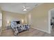 Bedroom with wood floors, ceiling fan, and a window with shutter-style blinds at 3018 Andover Ct, Mount Dora, FL 32757