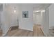 Inviting entryway with hardwood floors and neutral wall paint with direct access to other rooms at 3018 Andover Ct, Mount Dora, FL 32757