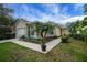 Beautiful home exterior with well-manicured lawn and vibrant landscaping at 3018 Andover Ct, Mount Dora, FL 32757