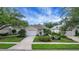 Charming single-story home featuring a well-manicured lawn and a two-car garage at 3018 Andover Ct, Mount Dora, FL 32757