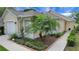 Close up of the landscaping with a beautiful flower garden with mulch and brick borders at 3018 Andover Ct, Mount Dora, FL 32757