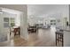 Bright, open-concept living room with hardwood floors and ample natural light at 3018 Andover Ct, Mount Dora, FL 32757